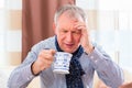 Senior drinking tea to cure flu Royalty Free Stock Photo