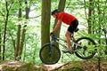 Senior driving in the forest with mountain bike