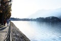 Senior elderly couple walking together outdoors along the italian mountain lake district Como. Lecco, Italy - November Royalty Free Stock Photo