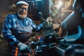 Senior elderly male turner mechanic working on machine tool for metal. Concept design industrial