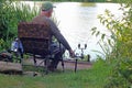 Senior or elderly man fishing or angling. Royalty Free Stock Photo