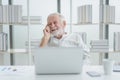 The senior elderly man work from home sitting and relaxing with happy and smiling emotion Royalty Free Stock Photo