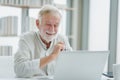 The senior elderly man work from home sitting and relaxing with happy and smiling emotion Royalty Free Stock Photo