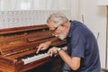 Senior Elderly musician enjoy happy playing music with Piano prevent Alzheimer disease