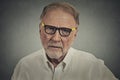 Senior elderly skeptical man with eyeglasses Royalty Free Stock Photo