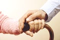 Mature female in elderly care facility gets help from hospital personnel nurse. Close up of aged wrinkled hands of senior woman. G Royalty Free Stock Photo