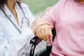 Senior elderly woman`s hand being held by a doctor Royalty Free Stock Photo
