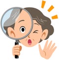 Senior elderly woman surprised at peering into magnifying glasses