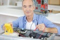 senior electrician working safely on switches Royalty Free Stock Photo