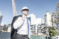 Senior elegant builder man in suit at construction site on sunny Royalty Free Stock Photo