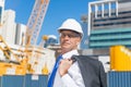 Senior elegant builder man in suit at construction site on sunny summer day Royalty Free Stock Photo