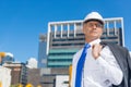 Senior elegant builder man in suit at construction site on sunny summer day Royalty Free Stock Photo