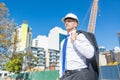 Senior elegant builder man in suit at construction site on sunny summer day Royalty Free Stock Photo