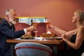 Mature couple having dinner together at restaurant Royalty Free Stock Photo