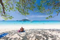 Senior European woman relaxing on the beach