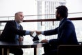 Senior executive or CEO talking and discussing for negotiation agreement and deal with partner about project and handshake. Royalty Free Stock Photo