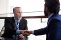 Senior executive or CEO talking and discussing for negotiation agreement and deal with partner about project and handshake. Royalty Free Stock Photo