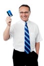 Senior executive showing his credit card Royalty Free Stock Photo