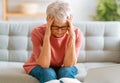 Senior exhausted woman having headache Royalty Free Stock Photo