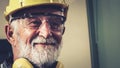 Senior factory worker or engineer close up portrait in factory Royalty Free Stock Photo