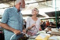 Senior family couple choosing bio food fruit and vegetable on the market during weekly shopping Royalty Free Stock Photo