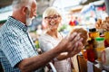 Senior family couple choosing bio food fruit and vegetable on the market during weekly shopping Royalty Free Stock Photo