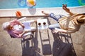 Senior family  enjoy on summer holiday near swimming pool.Top view Royalty Free Stock Photo