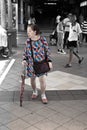 Senior with a fancy dress, MRT Station, Singapore