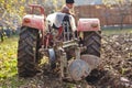 Senior farmer plowing Royalty Free Stock Photo