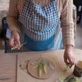 Senior female artisan creating handmade ceramics in pottery studio