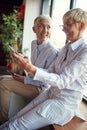 Senior female colleagues enjoying the break at workplace together. Business, office, job Royalty Free Stock Photo