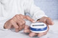 Senior women diabetic measure glucose level at home