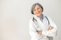 Senior female doctor standing with arms folded Royalty Free Stock Photo