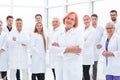 Senior female doctor standing in front of her colleagues. Royalty Free Stock Photo