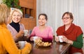 Senior female friends drinking coffee Royalty Free Stock Photo