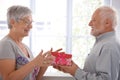 Senior female getting present from husband