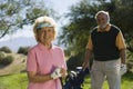 Senior Female Golfer Smiling Royalty Free Stock Photo