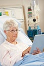 Senior Female Patient Relaxing In Hospital Bed Royalty Free Stock Photo