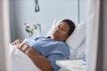 Senior female patient sleeping on bed in hospital room Royalty Free Stock Photo