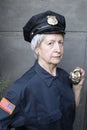 Senior female police officer holding handcuffs Royalty Free Stock Photo