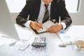 Senior financial asian businessman sitting at his workstation in