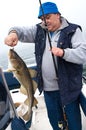 Senior fisherman with trophy