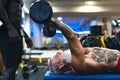 Senior fit man weight lifting with personal trainer in gym sport club - Mature bodybuilder doing workout session