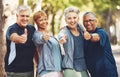 Senior fitness group, thumbs up and portrait with smile, diversity and happiness in park for wellness. Happy workout