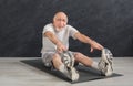 Senior fitness man stretching indoors