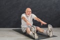 Senior fitness man stretching indoors Royalty Free Stock Photo