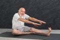 Senior fitness man stretching indoors
