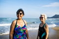 Senior friends chilling on the beach