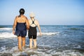 Senior friends chilling on the beach