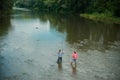 Senior friends fishing by the lake. Handsome man relaxing. Family day. United with nature. Hobby and sport activity Royalty Free Stock Photo